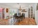 Cozy dining room featuring wood furnishings, and brick flooring at 4174 Fallwood Cir, Orlando, FL 32812