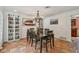 Dining room featuring a wooden table set, brick flooring, and shelves at 4174 Fallwood Cir, Orlando, FL 32812