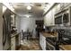 Bright kitchen with stainless appliances, granite countertops and a view to the Gathering room at 4174 Fallwood Cir, Orlando, FL 32812