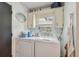 Functional laundry room with washer, dryer and built-in shelving at 4174 Fallwood Cir, Orlando, FL 32812