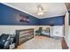 The home office features carpet, modern grey furniture, and an accent wall at 4174 Fallwood Cir, Orlando, FL 32812