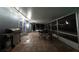 Outdoor patio featuring tile floors, a grill, dining table, chairs, and access to the lush backyard at 4174 Fallwood Cir, Orlando, FL 32812