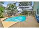 Sparkling screened-in pool with ample deck space for lounging and enjoying the beautiful surroundings at 4174 Fallwood Cir, Orlando, FL 32812