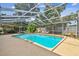 Inviting screened-in pool area with comfortable seating and lush landscaping, ideal for outdoor relaxation at 4174 Fallwood Cir, Orlando, FL 32812
