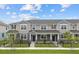 Charming townhomes feature neutral exteriors, well-maintained landscaping, and inviting entrances at 4232 Sadler Rd, Apopka, FL 32712