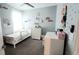 This bedroom has a charming decor with a single bed, dresser, and ample space at 4687 Fairy Tale Cir, Kissimmee, FL 34746