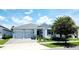 Charming one-story home with a two-car garage, well-manicured lawn, and beautiful curb appeal at 4687 Fairy Tale Cir, Kissimmee, FL 34746