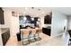 Beautiful kitchen with dark cabinetry, granite countertops, stainless appliances, and tile flooring at 4687 Fairy Tale Cir, Kissimmee, FL 34746