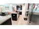 Modern kitchen featuring dark cabinets, an island with bar seating, and stainless steel appliances at 4687 Fairy Tale Cir, Kissimmee, FL 34746