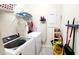 A functional laundry room with modern washer/dryer and plenty of storage space at 4687 Fairy Tale Cir, Kissimmee, FL 34746