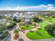 Picturesque aerial view of a luxurious resort featuring manicured lawns, water views, and elegant landscaping at 5067 Latrobe Dr, Windermere, FL 34786