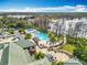 Beautiful aerial view showcasing resort pools, lush landscaping, and stunning water views, ideal for relaxation and recreation at 5067 Latrobe Dr, Windermere, FL 34786