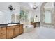 Elegant bathroom with a soaking tub, double vanities, and natural light at 5067 Latrobe Dr, Windermere, FL 34786