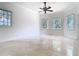 Bright bedroom with large windows and neutral walls and floors at 5067 Latrobe Dr, Windermere, FL 34786