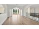 Spacious foyer with hardwood floors, columns, and access to a balcony at 5067 Latrobe Dr, Windermere, FL 34786