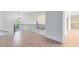 Foyer and staircase with wrought iron railing and beautiful hardwood floors at 5067 Latrobe Dr, Windermere, FL 34786