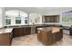 Spacious kitchen area with dark wood cabinets and granite countertops at 5067 Latrobe Dr, Windermere, FL 34786