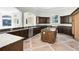 Spacious kitchen area with dark wood cabinets and granite countertops at 5067 Latrobe Dr, Windermere, FL 34786