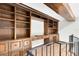 Home library showcasing a full wall of wooden shelving and cabinets on the second floor at 5067 Latrobe Dr, Windermere, FL 34786