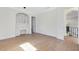 Office area with built-in desk and shelves, hardwood floors, and views of the foyer at 5067 Latrobe Dr, Windermere, FL 34786