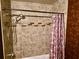 Shower and tub area with modern tile, a shower head, and a decorative shower curtain at 527 Leland Dr, Deltona, FL 32725