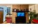 Living area featuring a charming brick fireplace, creating a warm and inviting atmosphere at 527 Leland Dr, Deltona, FL 32725