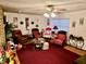 Spacious living room filled with natural light, featuring multiple cozy seating arrangements at 527 Leland Dr, Deltona, FL 32725