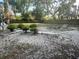 Residential backyard featuring sparse landscaping, with a trampoline and basketball hoop in view at 5298 Rose Ave, Orlando, FL 32810