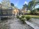 Residential backyard featuring sparse landscaping, with a trampoline and basketball hoop in view at 5298 Rose Ave, Orlando, FL 32810