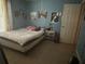 Bedroom has a large window and a simple bed and dresser at 5298 Rose Ave, Orlando, FL 32810