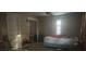 Bedroom features an enclosed closet, tan walls, and large windows at 5298 Rose Ave, Orlando, FL 32810