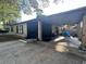 Spacious carport area providing covered parking and extra storage space for outdoor equipment at 5298 Rose Ave, Orlando, FL 32810