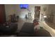 Open living area with tile flooring, comfortable seating, and a view into the kitchen at 5298 Rose Ave, Orlando, FL 32810