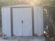 The shot shows the white shed in the back yard at 5298 Rose Ave, Orlando, FL 32810