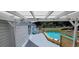 Backyard featuring a covered deck and above-ground pool; a perfect outdoor oasis for relaxation and recreation at 6222 Dovecrest Trl, Lakeland, FL 33810