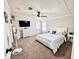 Spacious bedroom with plush carpet, ceiling fan, and comfortable queen-sized bed at 6222 Dovecrest Trl, Lakeland, FL 33810