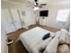 Cozy bedroom with neutral tones, ceiling fan, and a comfortable queen-sized bed at 6222 Dovecrest Trl, Lakeland, FL 33810