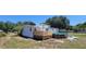 Charming home exterior with covered deck and above ground pool, perfect for outdoor living and entertaining at 6222 Dovecrest Trl, Lakeland, FL 33810
