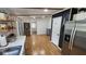 Modern kitchen with stainless steel appliances, a view into dining area, and ample counter space for meal prep at 6222 Dovecrest Trl, Lakeland, FL 33810