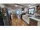 Well-lit kitchen with stainless steel appliances, open shelving, and access to the dining area, perfect for entertaining at 6222 Dovecrest Trl, Lakeland, FL 33810
