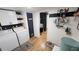 Well-organized laundry room with white appliances, ample storage, and charming decor at 6222 Dovecrest Trl, Lakeland, FL 33810