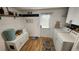 Functional mud room featuring white shiplap walls, custom pet storage, and convenient access to the backyard at 6222 Dovecrest Trl, Lakeland, FL 33810