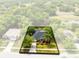 Aerial view of home showcasing a large lot, manicured lawn and mature trees at 640 Brookfield Pl, Apopka, FL 32712