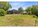 Beautiful backyard featuring a screened in patio and plenty of space for activities at 640 Brookfield Pl, Apopka, FL 32712
