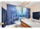 This bathroom features a single sink vanity and shower with pirate-themed curtain at 640 Brookfield Pl, Apopka, FL 32712