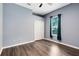 This simple bedroom offers neutral walls, wood-look floors and a ceiling fan at 640 Brookfield Pl, Apopka, FL 32712