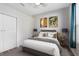 Comfortable bedroom with neutral tones, decorative pillows, and modern art, creating a serene and inviting atmosphere at 640 Brookfield Pl, Apopka, FL 32712