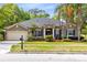 Charming single-story home with a well-manicured lawn and inviting front entrance at 640 Brookfield Pl, Apopka, FL 32712