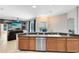 Kitchen and view to the adjacent living room, with sliding glass door access to pool at 640 Brookfield Pl, Apopka, FL 32712