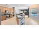 Open kitchen with an island, stainless steel appliances, and view to the living room and pool at 640 Brookfield Pl, Apopka, FL 32712